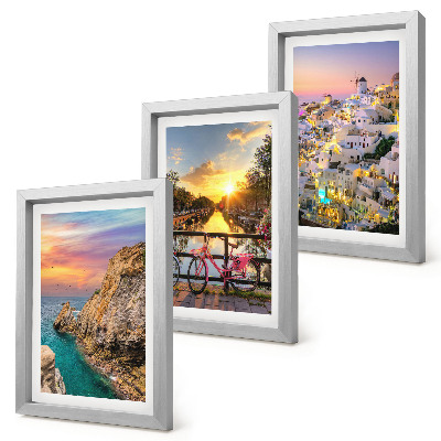 Mur de cadres Vue sur la mer au coucher du soleil et sur la ville