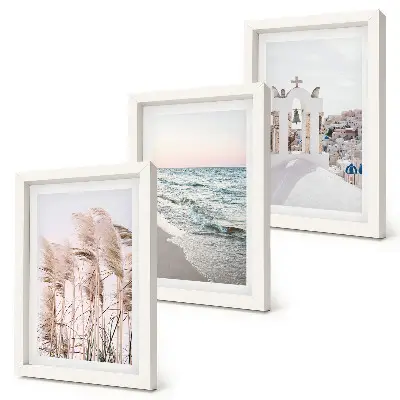 Mur de cadres plantes de bord de mer, vagues et vue sur les maisons blanches