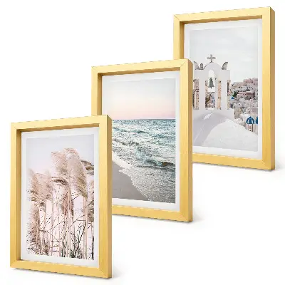 Mur de cadres plantes de bord de mer, vagues et vue sur les maisons blanches