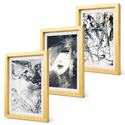 Mur de cadres avec motifs abstraits en nuances de noir et blanc