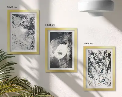 Mur de cadres avec motifs abstraits en nuances de noir et blanc