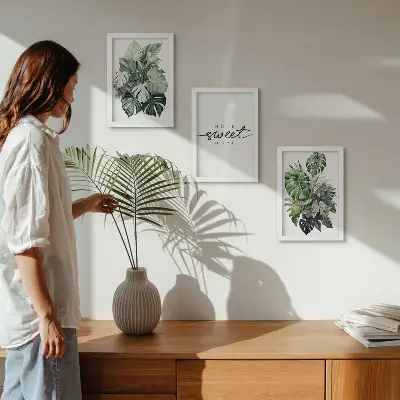 Ensemble de 3 tableaux représentant des plantes vertes avec l'inscription « Douce maison »