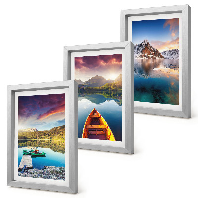 Mur de cadres Des lacs tranquilles avec des paysages de montagne et un bateau