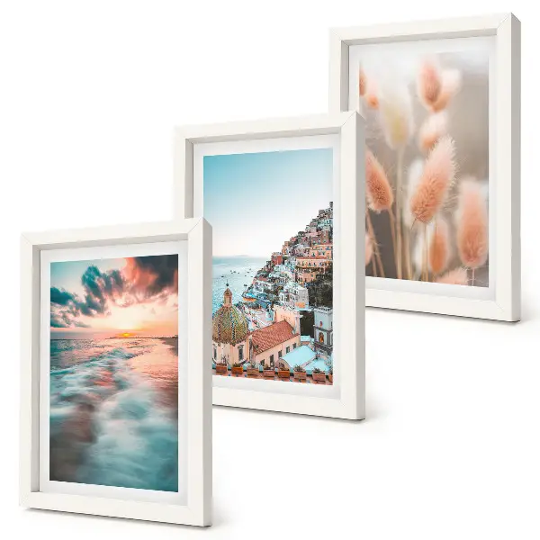 Ensemble de 3 tableaux représentant un coucher de soleil sur la mer avec des maisons colorées et des fleurs
