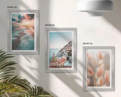 Ensemble de 3 tableaux représentant un coucher de soleil sur la mer avec des maisons colorées et des fleurs