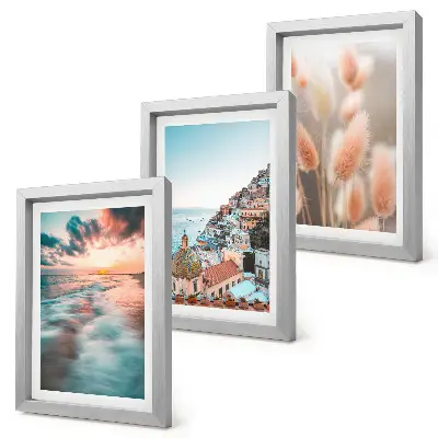 Ensemble de 3 tableaux représentant un coucher de soleil sur la mer avec des maisons colorées et des fleurs