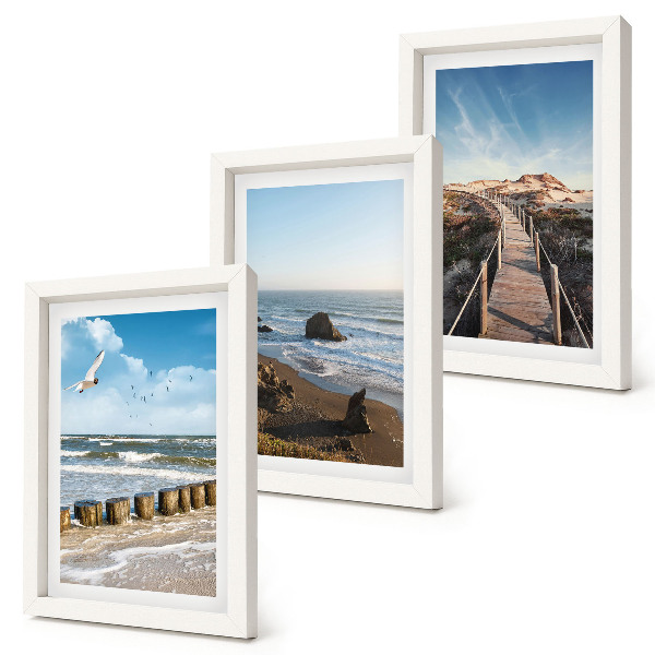 Lot de 3 tableaux Vue de la plage avec les vagues, le ciel et une jetée.