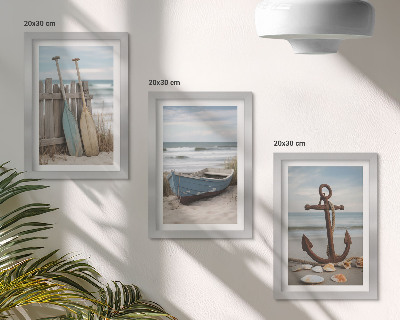 Ensemble de 3 tableaux Une plage avec une barque et une ancre dans le sable