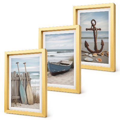 Ensemble de 3 tableaux Une plage avec une barque et une ancre dans le sable
