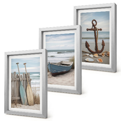 Ensemble de 3 tableaux Une plage avec une barque et une ancre dans le sable