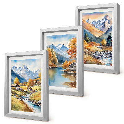Lot de 3 tableaux Montagnes aux couleurs automnales, traversées par une rivière et parsemées de chalets.