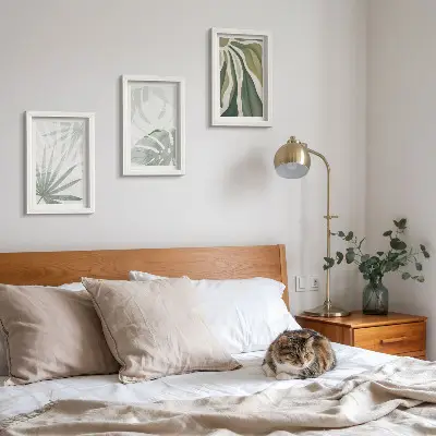 Ensemble de 3 tableaux représentant des feuilles de plantes dans des tons de vert et de gris