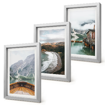 Mur de cadres Vue des montagnes sur le lac avec un bateau et un paysage de plage