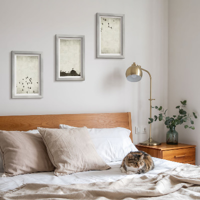 Mur de cadres Oiseaux en vol peints dans un style minimaliste