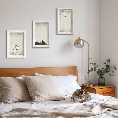 Mur de cadres Oiseaux en vol peints dans un style minimaliste