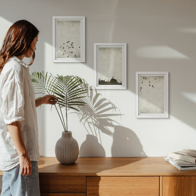 Mur de cadres Oiseaux en vol peints dans un style minimaliste