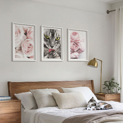 Cadre photo mural Chat dans des fleurs roses