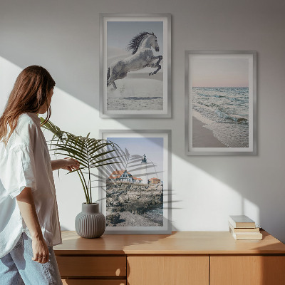 Cadre photo mural Chevaux plage phare vagues
