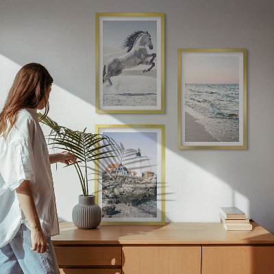 Cadre photo mural Chevaux plage phare vagues