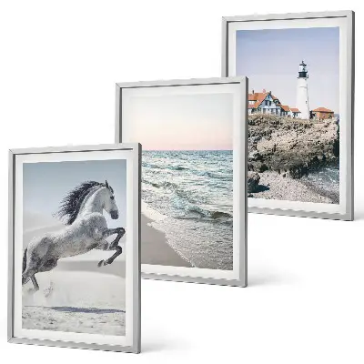 Cadre photo mural chevaux sur la plage avec un phare et des vagues