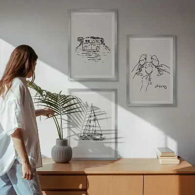Lot de 3 tableaux pour salon motif de voilier dans une maison au bord de l'eau