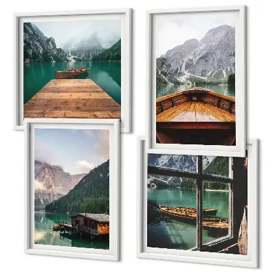 Mur de tableaux représentant des paysages de montagne avec des chalets et des bateaux