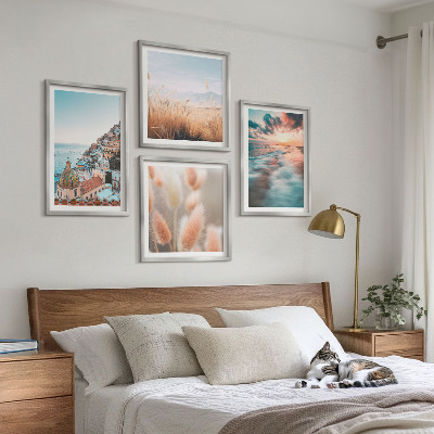 Mur de tableaux Coucher de soleil sur la mer, maisons et fleurs