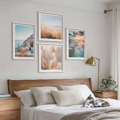 Mur de tableaux Coucher de soleil sur la mer, maisons et fleurs