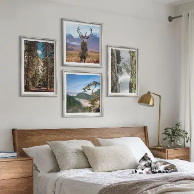 Ensemble de 4 tableaux représentant une nature sauvage avec forêt, montagnes et cerf