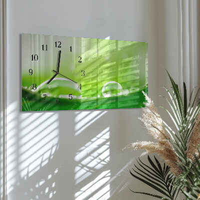 Horloge horizontale en verre Des gouttes sur une feuille